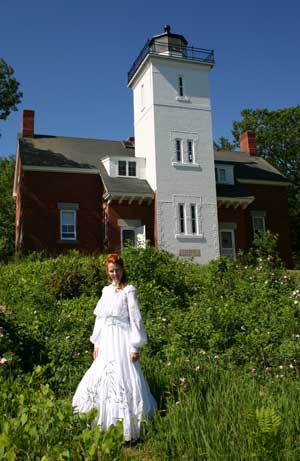 Edwardian Lady in classic white batiste gown at the lighthouse