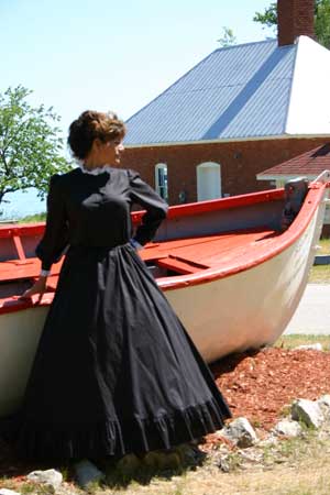 Civil War Era lady in cotton blouse and hoopskirt